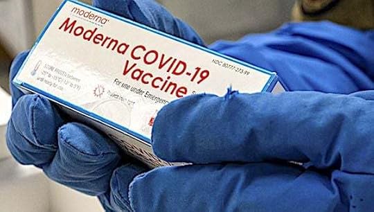 Air Force Staff Sgt. Daniel Monzon-Kazhe holds a box of Moderna COVID-19 vaccines at Yokota Air Base, Japan, Dec. 26, 2020. The 374th Medical Group received 800 doses as its first wave of COVID-19 vaccine shipments. (U.S. Air Force photo by Staff Sgt. Gabrielle Spalding)