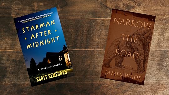 Two books on wood tabletop. Starman After Midnight and Narrow the Road.