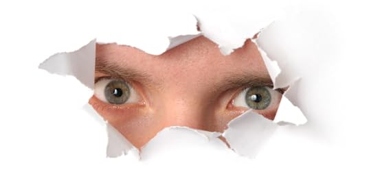 eyes looking through torn paper