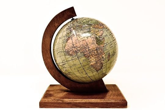 A globe of the world held in a wooden stand
