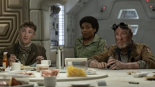 The crew of the Maginot on Alien: Earth around a table.