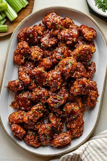 platter of baked honey bbq chicken bites with fresh chives on top.