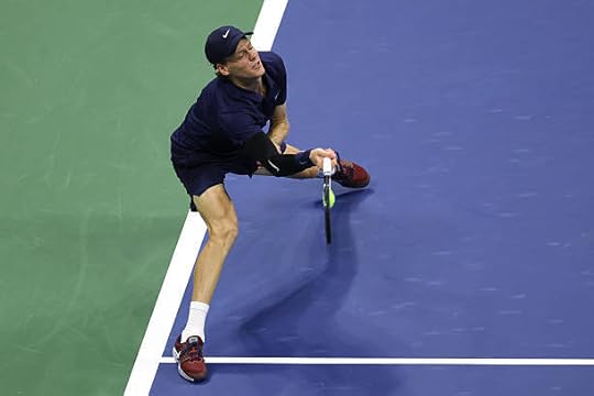 Jannik Sinner of Italy returns a shot against Felix Auger-Aliassime of Canada during their Men's Singles Semifinal match on Day Thirteen of the 2025...