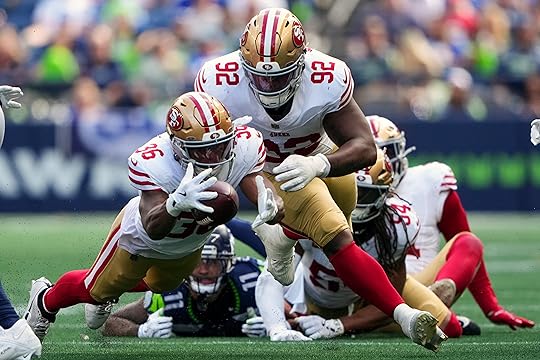 San Francisco 49ers safety Marques Sigle (36) triest to get...