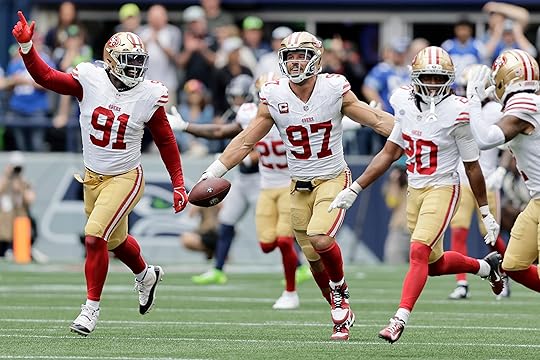 San Francisco 49ers defensive end Nick Bosa (97) runs down...