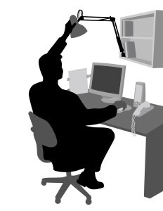 Man at desk with light