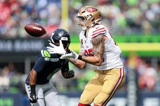 SEATTLE, WASHINGTON - SEPTEMBER 07: George Kittle #85 of the San Francisco 49ers catches a pass against Coby Bryant #8 of the Seattle Seahawks during the first quarter during the game at Lumen Field on September 07, 2025 in Seattle, Washington. (Photo by Steph Chambers/Getty Images)