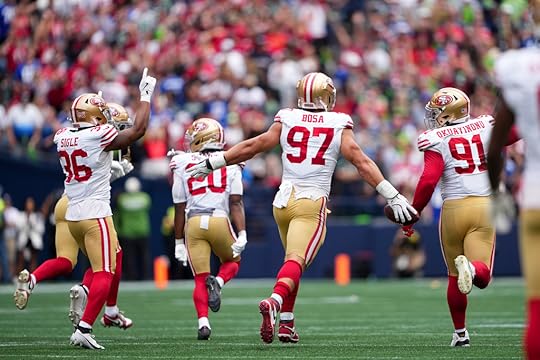 San Francisco 49ers defensive end Nick Bosa (97) runs down...