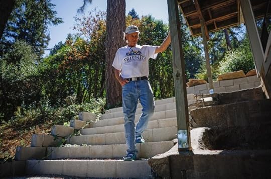 Rick Parfitt, a member of the Santa Clara County FireSafe Council, stands on concrete steps that he made at his home in Los Gatos. Parfitt has done significant work clearing flammable materials from five feet around his home. (Shae Hammond/Bay Area News Group)