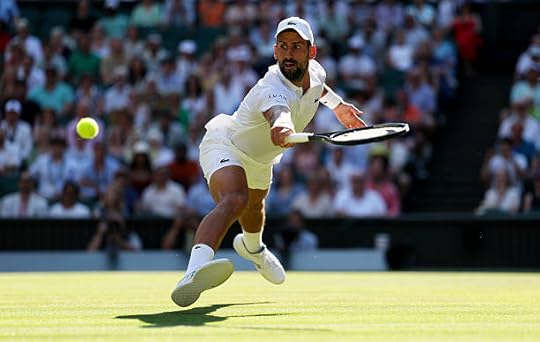 Novak Djokovic of Serbia plays a backhand volley against Jannik Sinner of Italy during the Gentlemen's Singles semi-final match on day twelve of The...