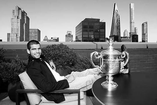 Open 2025 Champion Carlos Alcaraz of Spain poses for a photo on the roof of the Lotte New York Palace Hotel with the Men's Singles trophy following...