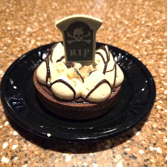 Chocolate-Caramel Tart: Chocolate tart shell filled with chocolate ganache, caramel sauce, and caramel cream topped with TWIX cookie bar pieces and a chocolate piece