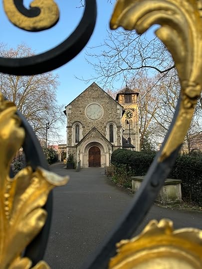 St. Pancras Old Church, framed by black and gold gates