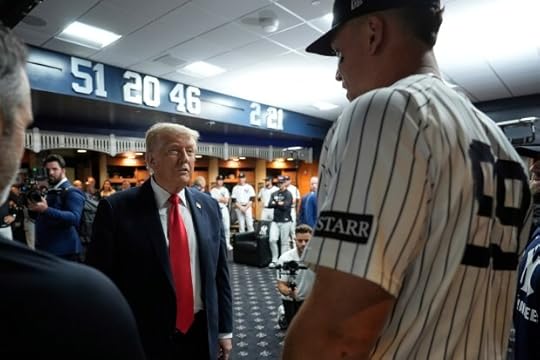 President Donald Trump talks with New York Yankees Aaron Judge, right, in the New York Yankees locker room before a baseball game against the Detroit Tigers, Thursday, Sept. 11, 2025, in New York. (AP Photo/Alex Brandon, Pool)