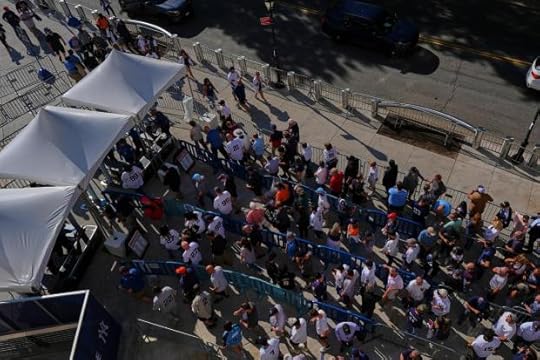 Fans wait to pass through security screening at Yankee Stadium before a baseball game between the New York Yankees and the Detroit Tigers Thursday, Sept. 11, 2025, in New York. (AP Photo/Frank Franklin II)