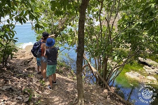 a family hiking to el chorro waterfall near montezuma