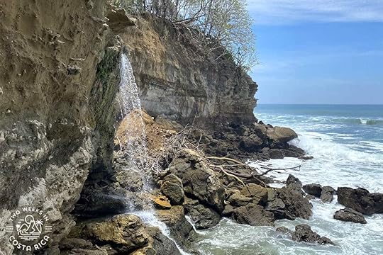 el chorro waterfall flowing into the ocean 