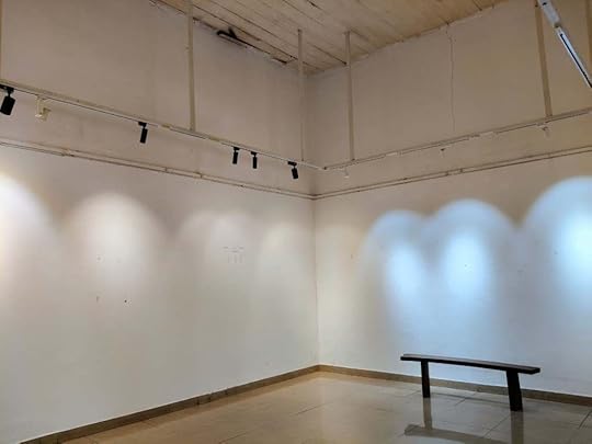 Blank walls of Eight Point Art Cafe. 