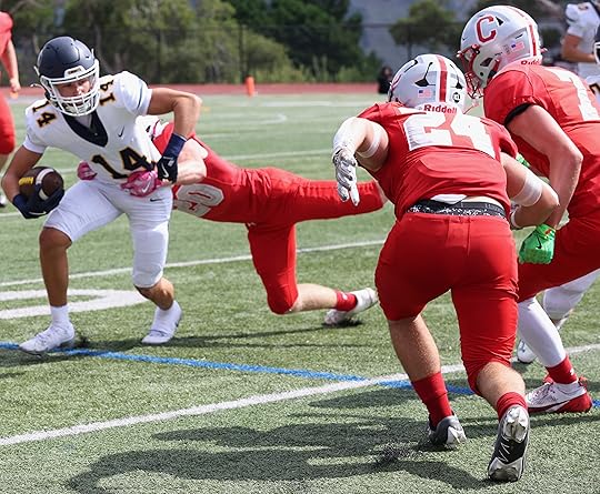 Carmel’s Kanan Seeklander hangs on to Soquel wide receiver Cash...