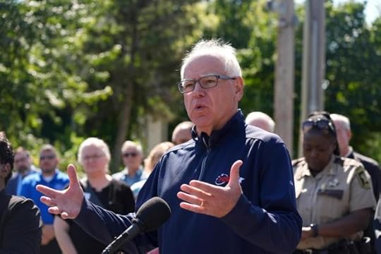 Minnesota Gov. Tim Walz speaks outside the Annunciation Catholic School following a shooting Wednesday, Aug. 27, 2025, in Minneapolis. (AP Photo/Bruce Kluckhohn)