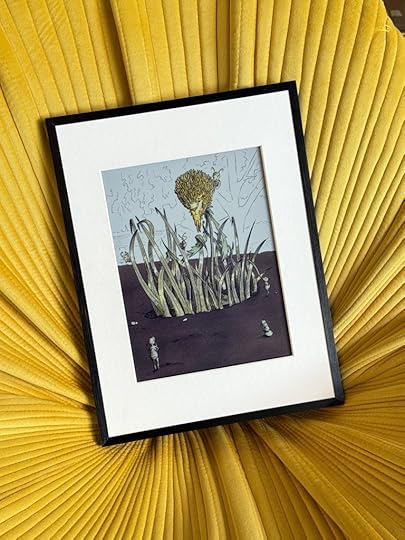 Image of a Bloomin8 color e-ink frame with Companyd displayed in a yellow chair