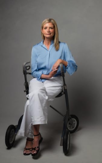 Katherine Wolf sitting on a walker chair