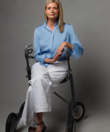 Katherine Wolf sitting on a walker chair