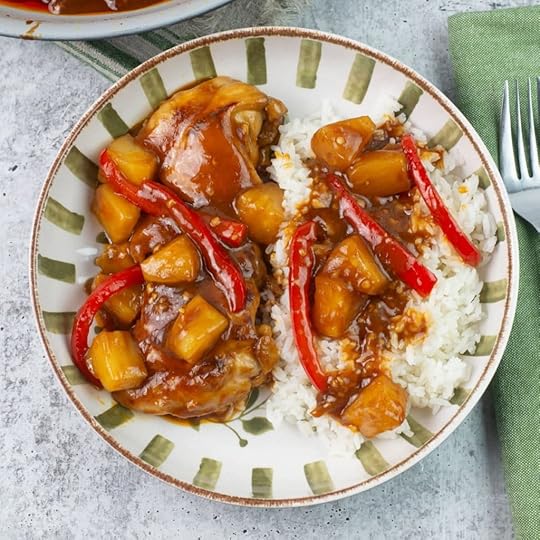 Hawaiian bbq chicken with pineapple served over rice in a bowl.