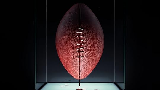 poster for jordan peele produced horror film him with a bloody football in a case
