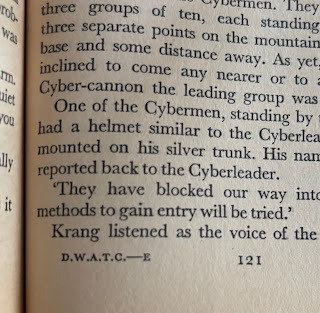 Example of a section break on page 121 of Doctor Who and the Cybermen (1975), showing the footnote "D.W.A.T.C. —E"