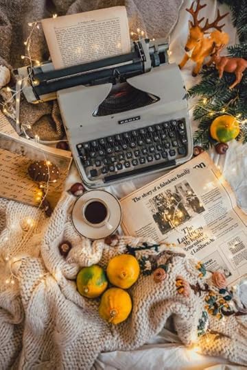 Typewriter surrounded by autumn leaves, fall writing scene