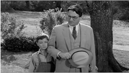 Gregory Peck as Atticus Finch in To Kill a Mockingbird walking with his son Jem, an example of a Flat Character Arc where the protagonist embodies moral truth.