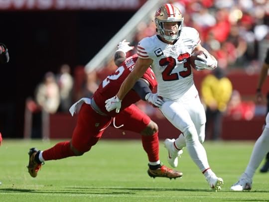 San Francisco 49ers' Christian McCaffrey (23) runs against Arizona Cardinals' Mack Wilson Sr. (2) in the third quarter at Levi's Stadium in Santa Clara, Calif., on Sunday, Sept. 21, 2025. (Nhat V. Meyer/Bay Area News Group)