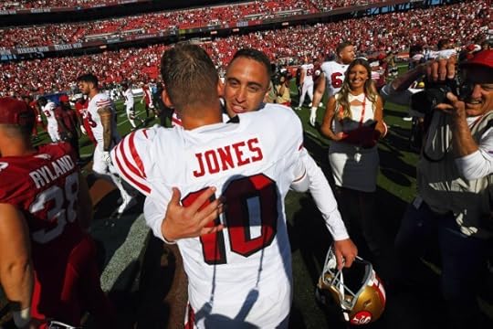 San Francisco 49ers kicker Eddy Pineiro (18) receives a hug from quarterback Mac Jones (10) after defeating the Arizona Cardinals during their NFL game at Levi's Stadium in Santa Clara, Calif., on Sunday, Sept. 21, 2025. San Francisco 49ers defeated the Arizona Cardinals 16-15. (Jose Carlos Fajardo/Bay Area News Group)