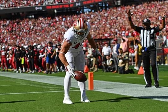 San Francisco 49ers' Kyle Juszczyk (44) spins the football in the end zone after scoring a touchdown in the fourth quarter of their NFL game at Levi's Stadium in Santa Clara, Calif., on Sunday, Sept. 21, 2025. San Francisco 49ers defeated the Arizona Cardinals 16-15. (Jose Carlos Fajardo/Bay Area News Group)