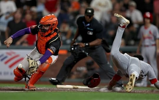 St. Louis Cardinals' Victor Scott II #11 scores past San Francisco Giants catcher Patrick Bailey #14 on an RBI double by Brendan Donovan #33 in the ninth inning of their MLB game at Oracle Park in San Francisco, Calif., on Tuesday, Sept. 23, 2025. (Jane Tyska/Bay Area News Group)