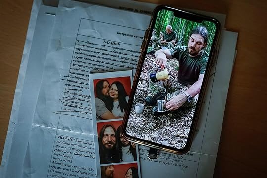 Photo of Ukrainian serviceman, who was declared missing-in-action in Donetsk region, is displayed on a phone of his wife, in Kyiv