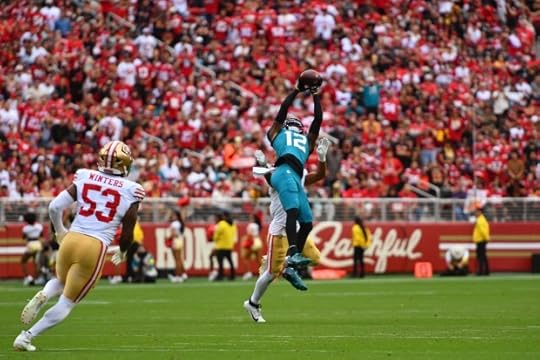 Jacksonville Jaguars wide receiver Travis Hunter (12) leaps to catch a pass against the San Francisco 49ers in the second quarter of their NFL game at Levi's Stadium in Santa Clara, Calif., on Sunday, Sept. 28, 2025. (Jose Carlos Fajardo/Bay Area News Group)