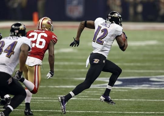 Baltimore Ravens' Jacoby Jones (12) takes off on a 108-yard run as San Francisco 49ers' Tramaine Brock (26) pursues during Super Bowl XLVII on Sunday, Feb. 3, 2013, at the Superdome in New Orleans. The Ravens beat the 49ers 34-31. (Jim Gensheimer/Bay Area News Group)