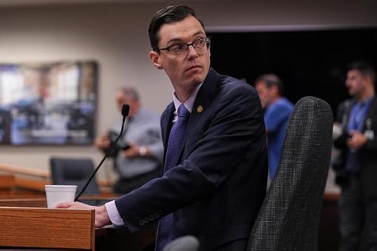 Missouri state Rep. Dirk Deaton, R-Seneca, sponsor of a bill that would redraw the state's U.S. House districts, looks into the crowd behind him as he testifies during a committee hearing on the subject Thursday, Sept. 4, 2025, in Jefferson City, Mo. (AP Photo/Jeff Roberson)