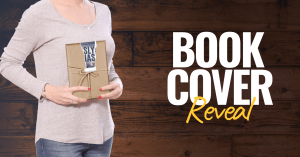 Woman holding a wrapped copy of Fastpitch with a strip of paper peeled away, revealing a glimpse of the cover