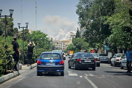 FILE - People take pictures of smoke rising from an Israeli strike in Tehran, Iran, June 23, 2025. (AP Photo, File)