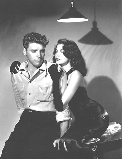 A promotional still of Burt Lancaster and Ava Gardener (in long black gloves) embracing for
