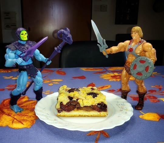 He-Man versus Skeletor over a piece of cake.