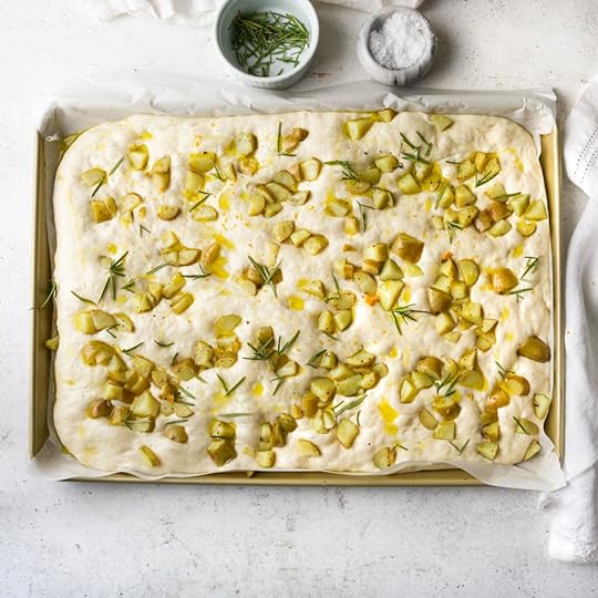 Puffed up focaccia covered with potatoes, rosemary and lemon zest.