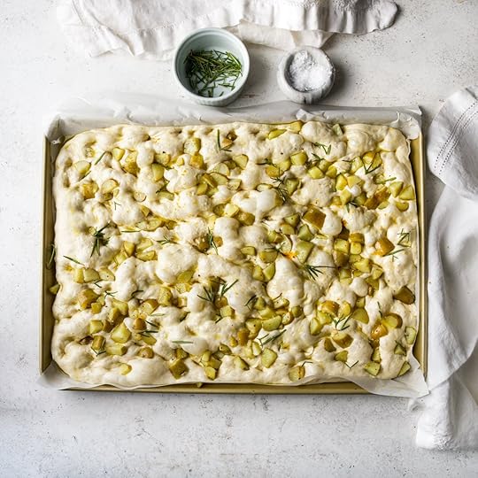 Really bubbly potato focaccia just before it goes into the oven.