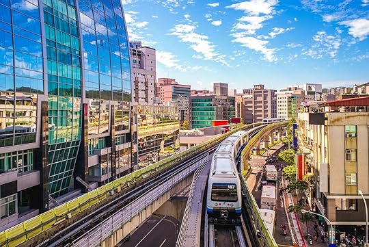 taipei MRT train passing skyscrapers