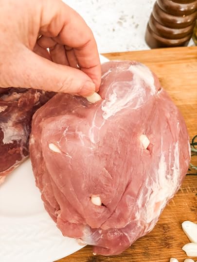 Marie demonstrating how the pockets of silvered garlic should look