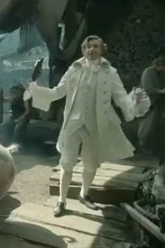 Rhys Darby, as Stede Bonnet, exuberant and resplendant in ivory white, in that one scene of OFMD where he is yelling Man for sale! Man for sale! Buy my booty!, extremely low fidelity