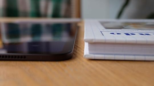 Apple iPad Pro M4 2024 thin next to book